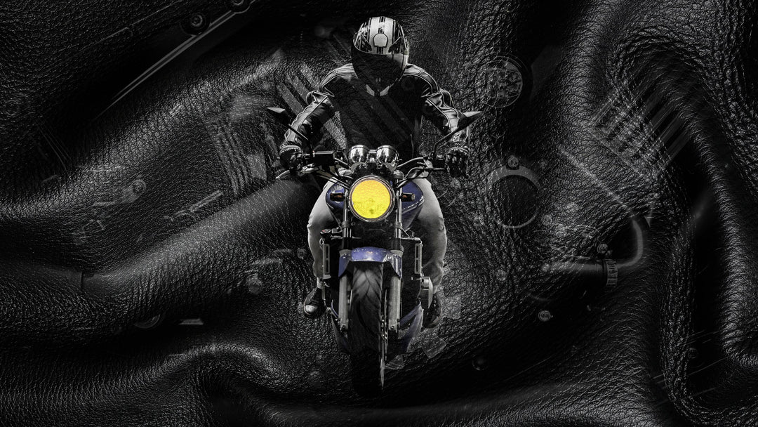 A sensual black-and-white banner image featuring a shirtless man holding a woman close.