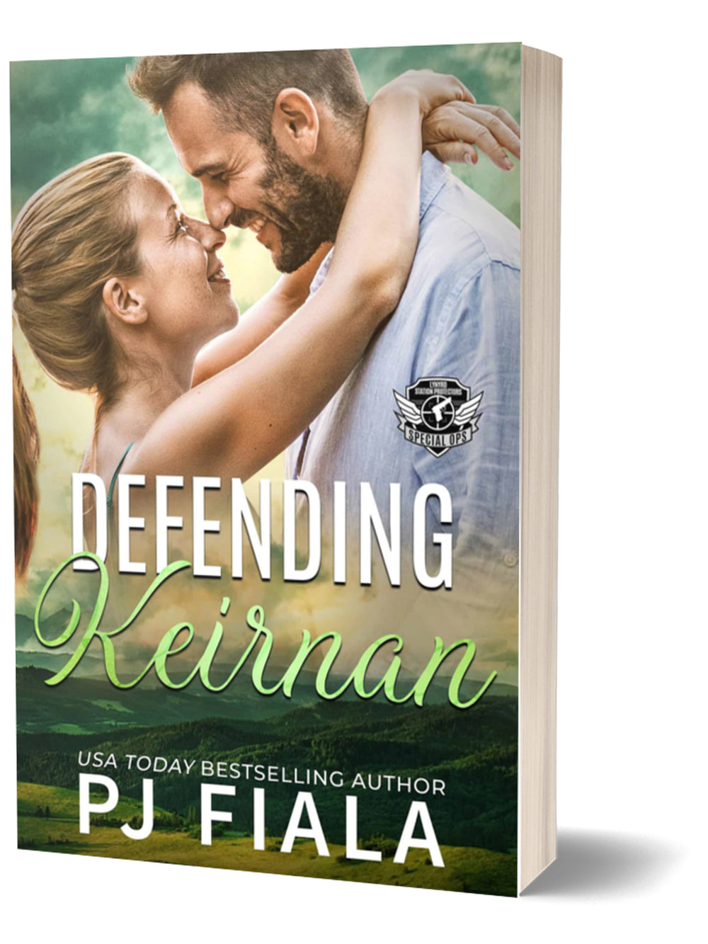 3D paperback of Defending Keirnan by USA Today bestselling author PJ Fiala. A happy couple shares a close embrace with their foreheads touching, the heroine's arms around the bearded hero as green hills stretch beneath a warm, sunlit sky. Part of the Lynyrd Station Protectors: Special Ops series.