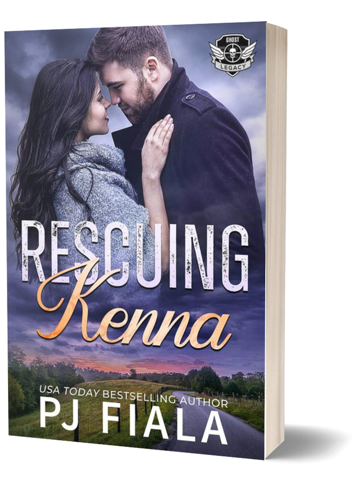  Paperback cover for Rescuing Kenna by USA Today bestselling author PJ Fiala. A couple stands forehead to forehead beneath dramatic twilight skies overlooking a quiet country road, part of the Ghost Legacy romantic suspense series.